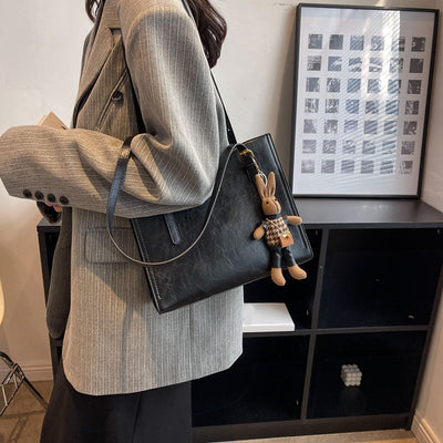 CHARMTOTE™ | Axelväska